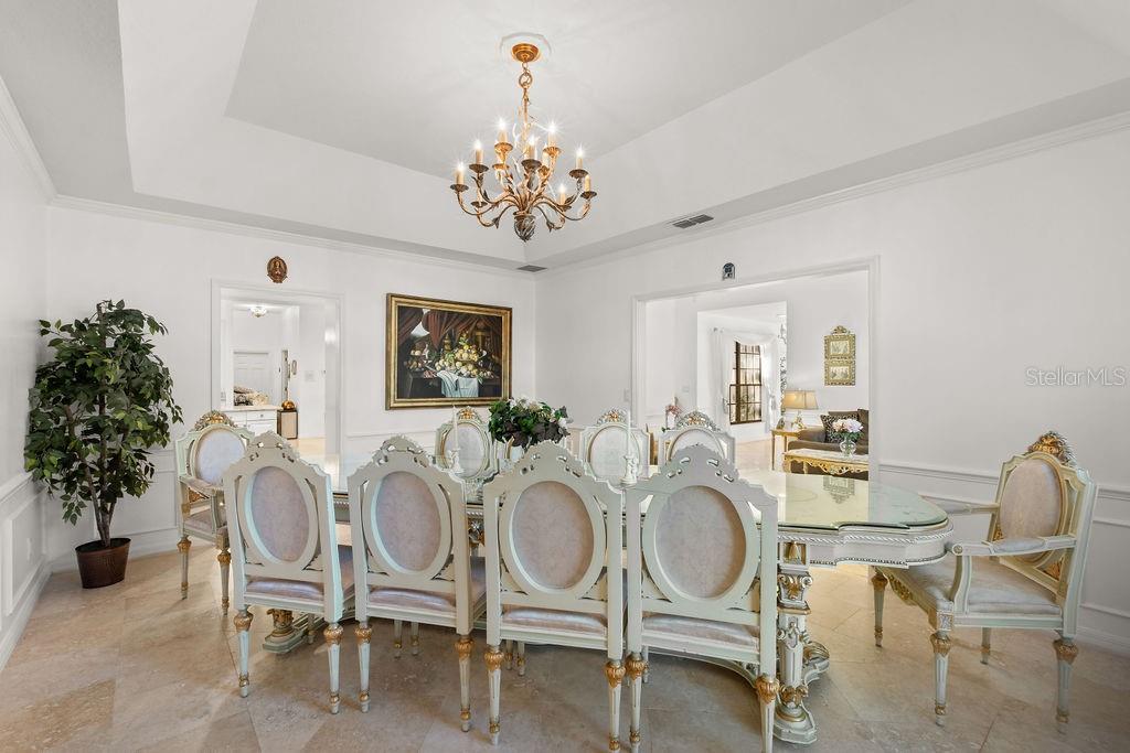 2958 Marquesas Court Windermere, FL 34786 - Photo 18 of 32 a dining room with furniture a chandelier and window