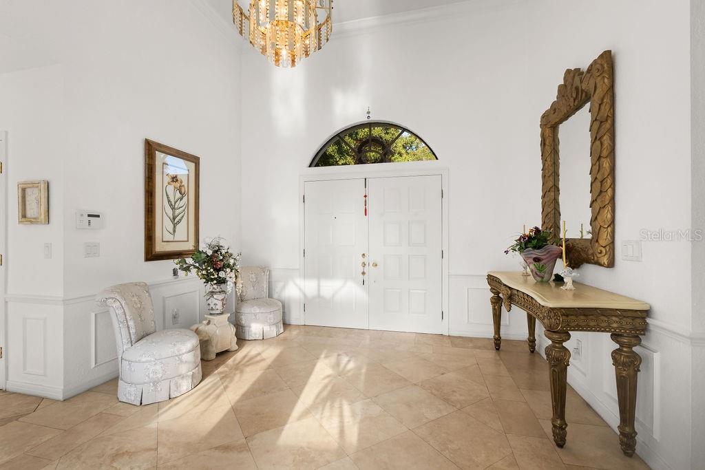 2958 Marquesas Court Windermere, FL 34786 - Photo 8 of 32 a living room with furniture and a chandelier