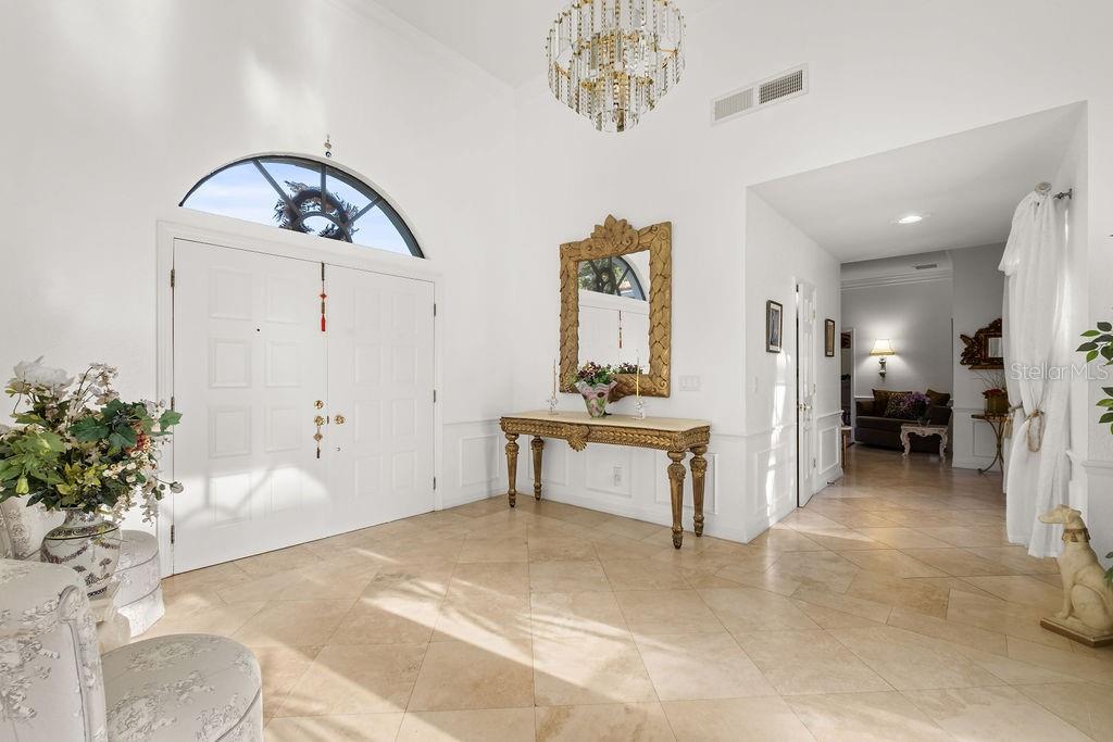 2958 Marquesas Court Windermere, FL 34786 - Photo 9 of 32 a view of a livingroom with furniture and a potted plant