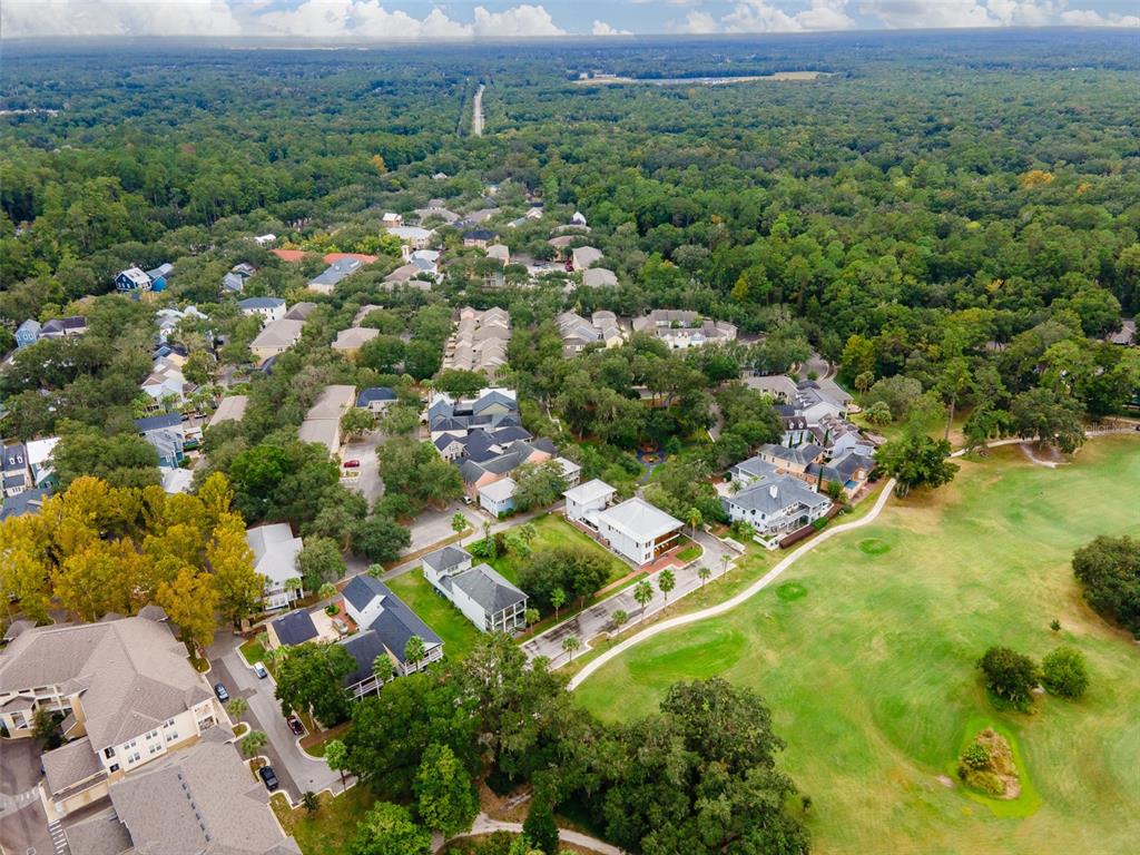 9139 Southwest 47 Place Gainesville, FL 32608 - Photo 18 of 41 an aerial view of residential houses with outdoor space and trees