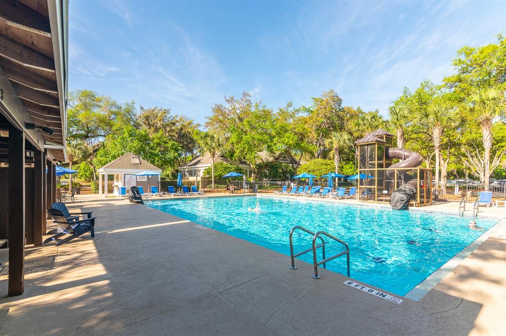 9139 Southwest 47 Place Gainesville, FL 32608 - Photo 30 of 41 a view of a house with a big yard plants and large trees