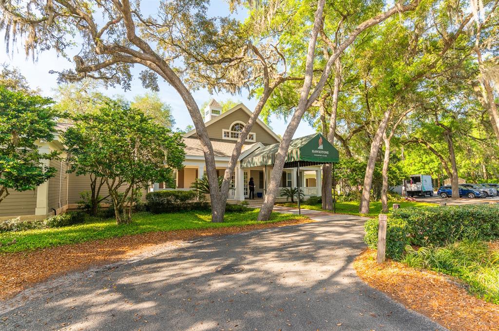 9139 Southwest 47 Place Gainesville, FL 32608 - Photo 31 of 41 a front view of a house with a yard