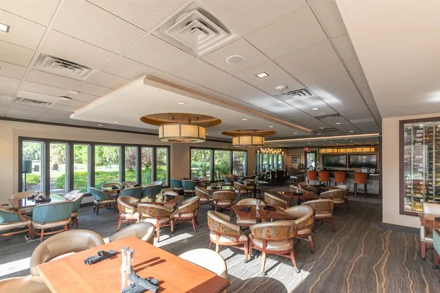 a room with lots of tables and chairs