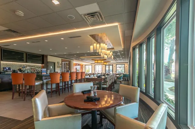 a view of a dining room with furniture window and outside view