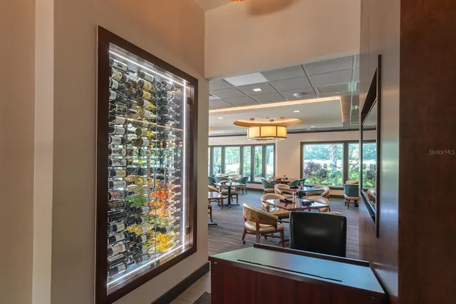 a room with wooden floor and large windows