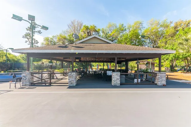 an outdoor space with swimming pool and furniture