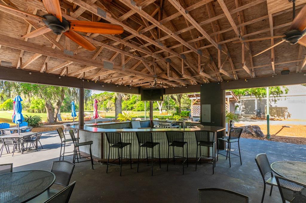 9139 Southwest 47 Place Gainesville, FL 32608 - Photo 40 of 41 a view of a dining room with furniture window and outside view