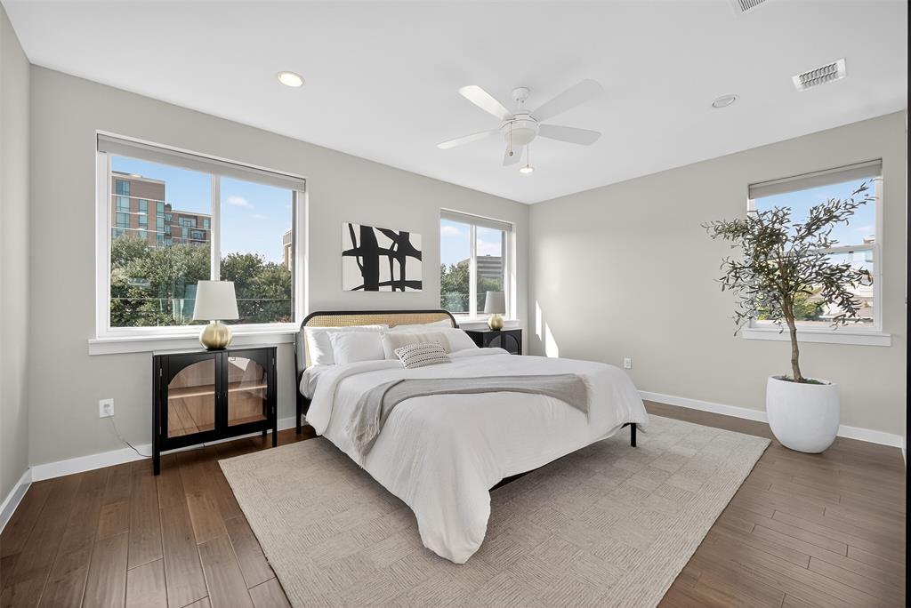 5333 Anita Street Dallas, TX 75206 - Photo 23 of 30 a bedroom with a large bed and a window