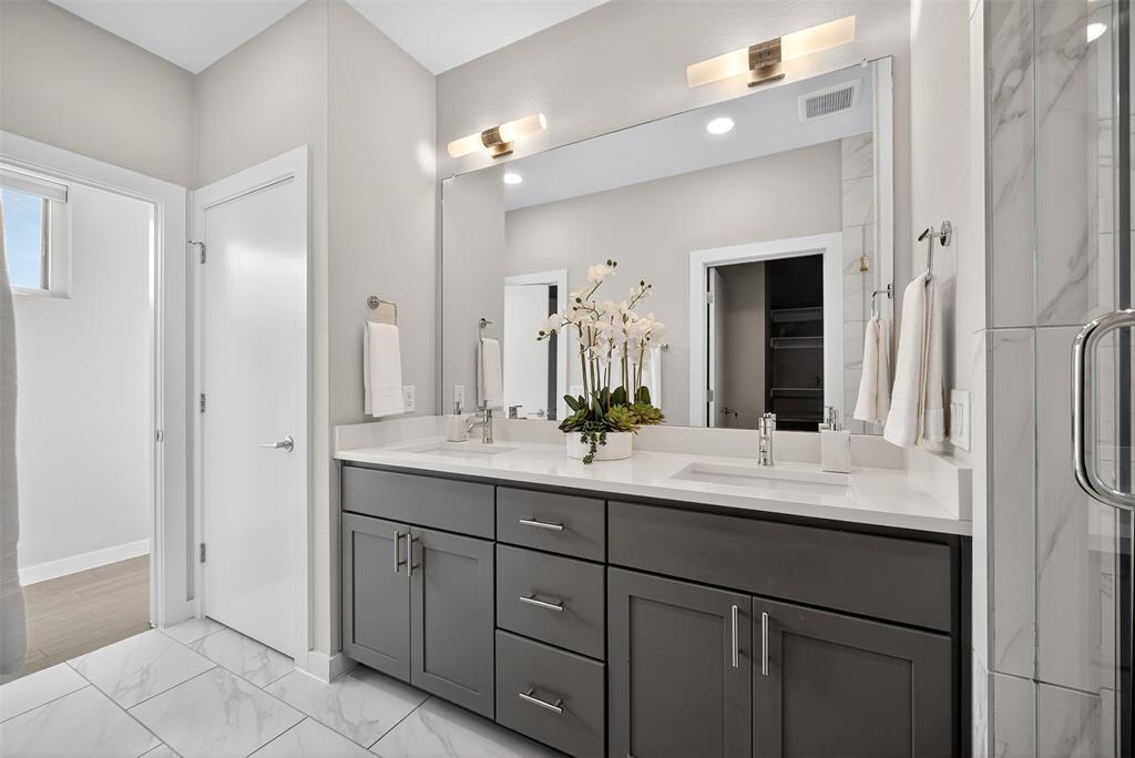 5333 Anita Street Dallas, TX 75206 - Photo 27 of 30 a bathroom with a sink vanity and a mirror