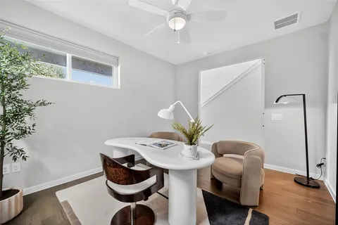 a table room with furniture and potted plant