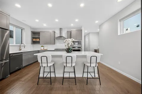 a large kitchen with a lot of counter space and a sink