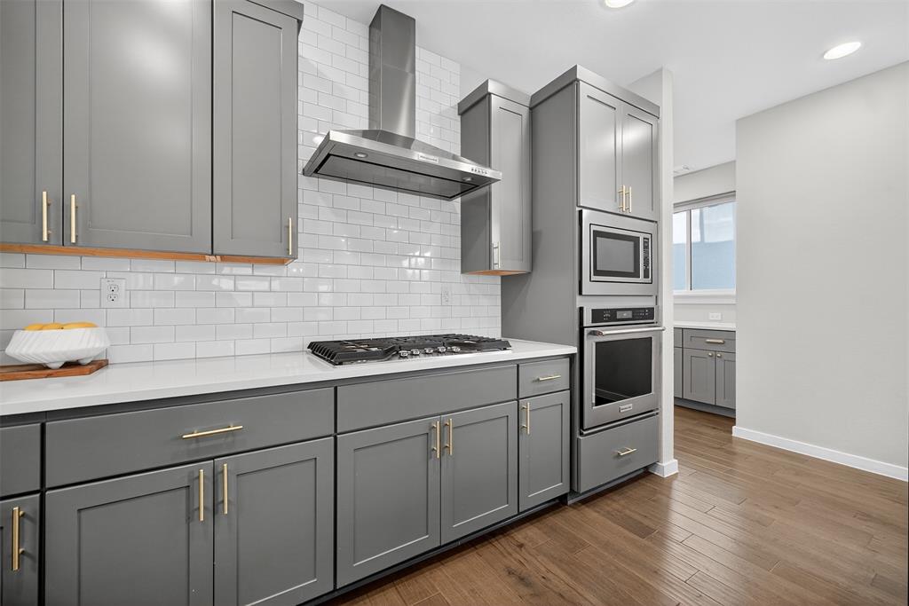 5333 Anita Street Dallas, TX 75206 - Photo 8 of 30 a kitchen with cabinets and steel stainless steel appliances