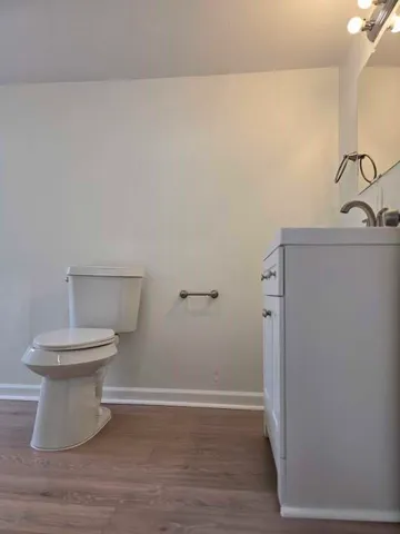 a view of a bathroom with wooden floor