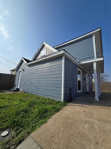 a backyard of a house with garage