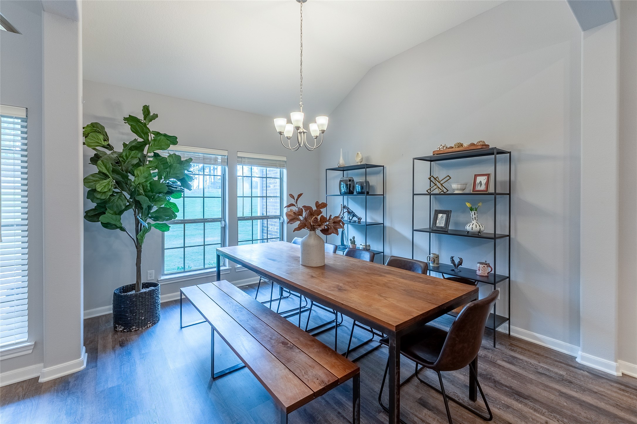 120 Sanctuary Road Huntsville, TX 77340 - Photo 3 of 38 a view of a dining room with furniture and wooden floor