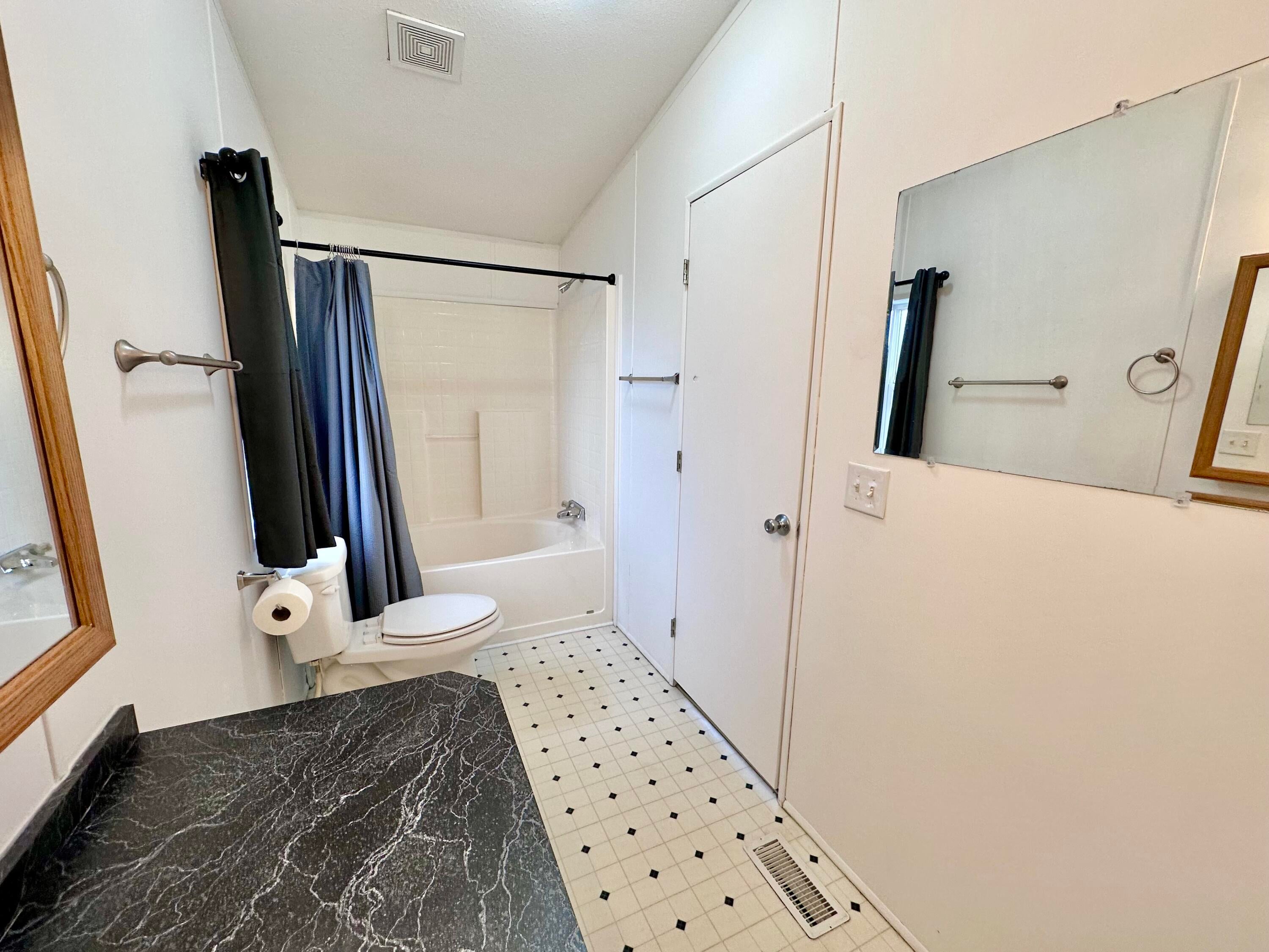 2832 Southwest 25th Street Redmond, OR 97756 - Photo 15 of 29 En suite has a tub/shower combo