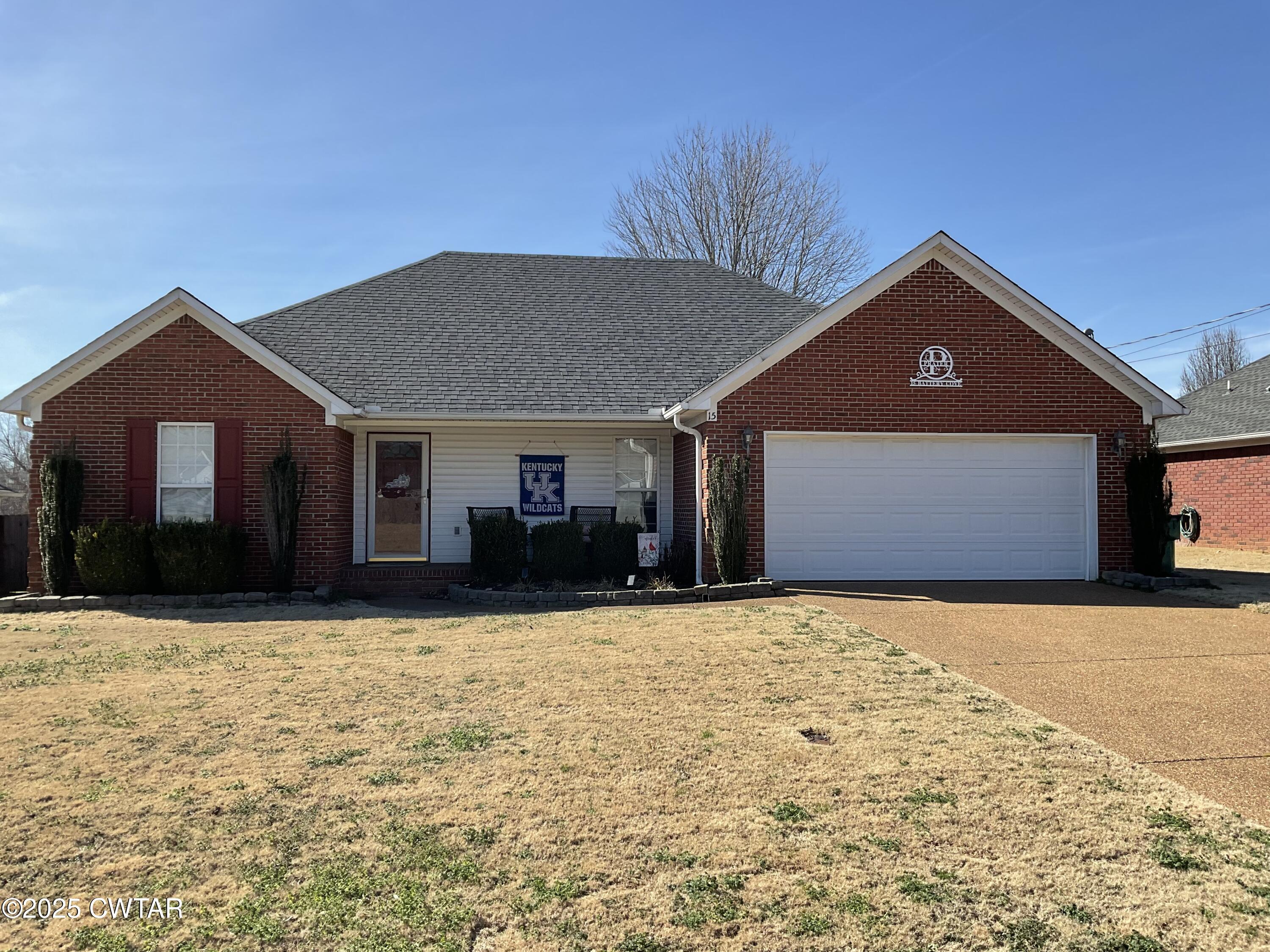 15 Battery Cove Jackson, TN 38305 - Photo 1 of 25 a front view of a house with a yard