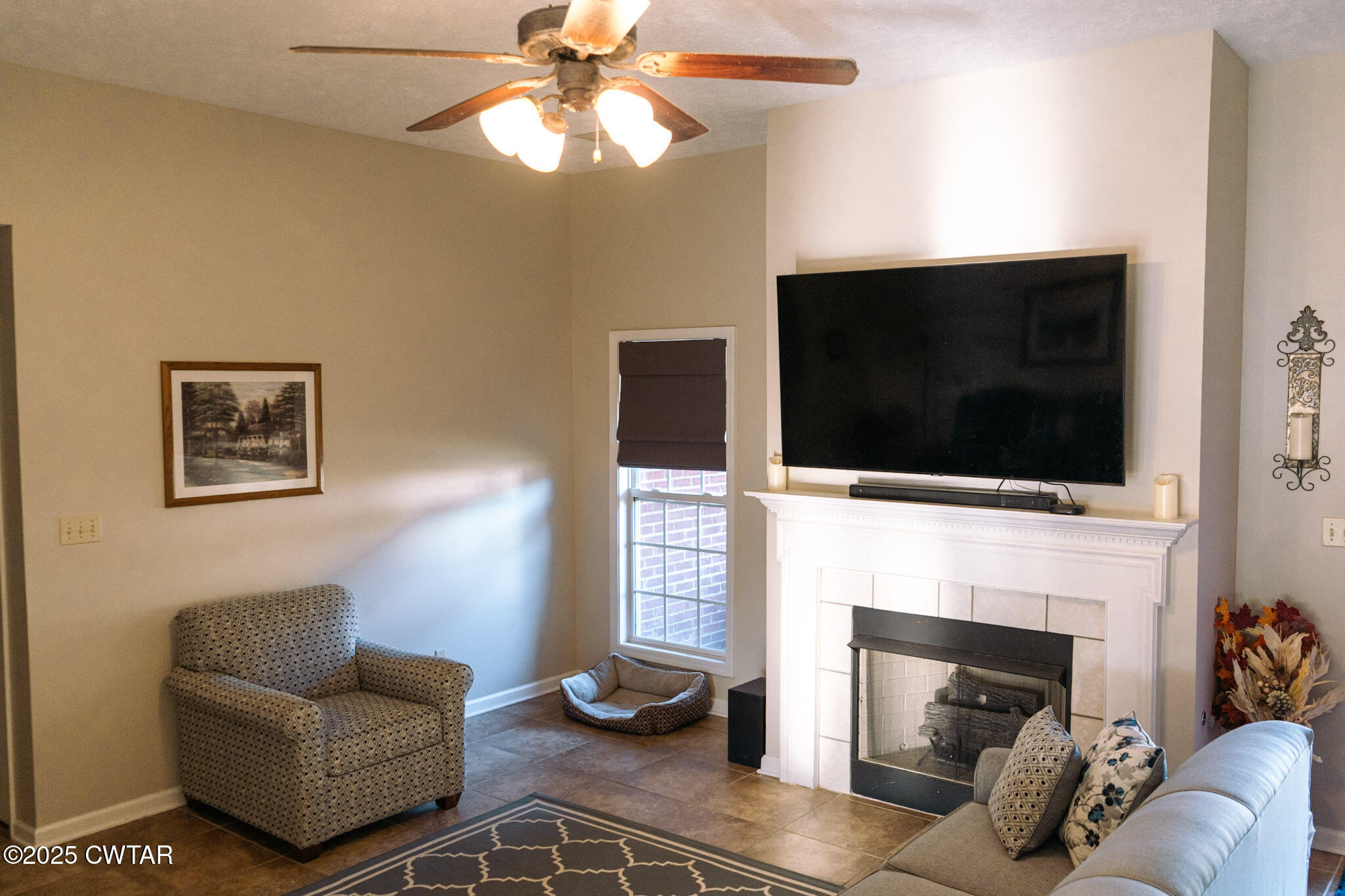 15 Battery Cove Jackson, TN 38305 - Photo 15 of 25 a living room with furniture a flat screen tv and a fireplace