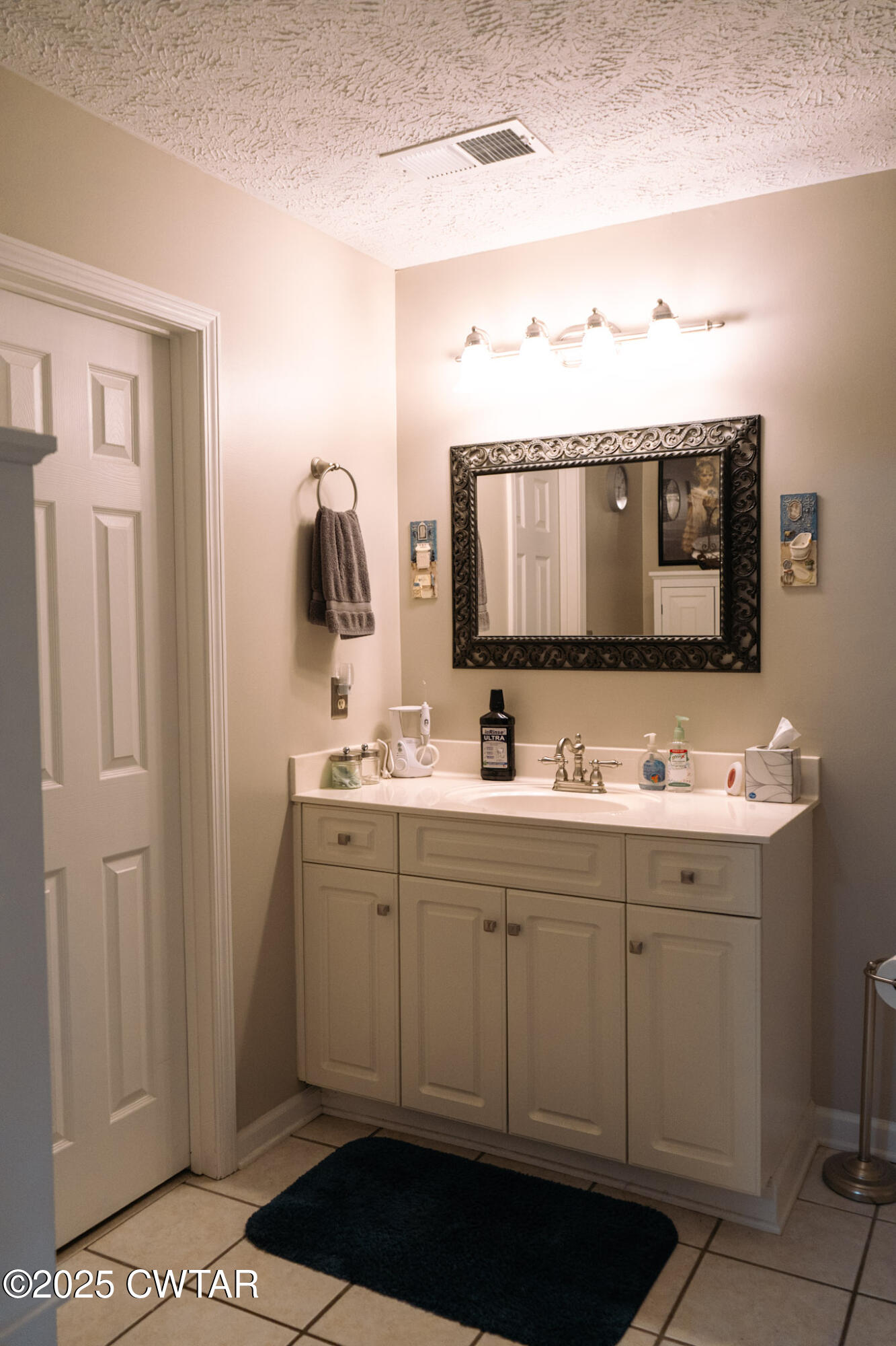 15 Battery Cove Jackson, TN 38305 - Photo 18 of 25 a bathroom with a sink and a mirror