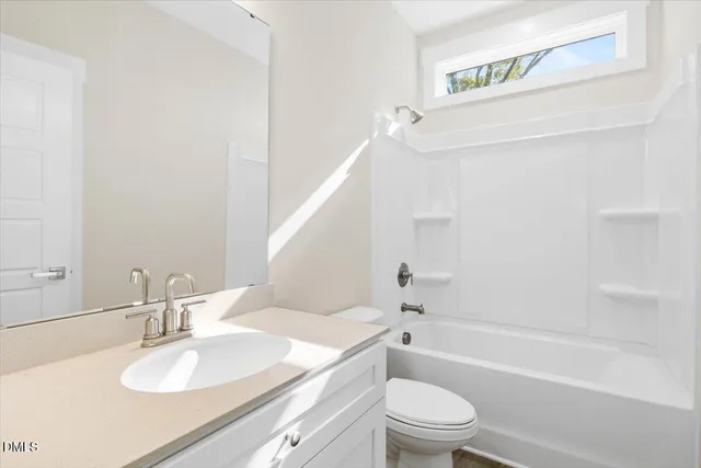 a bathroom with a sink a toilet and a bathtub