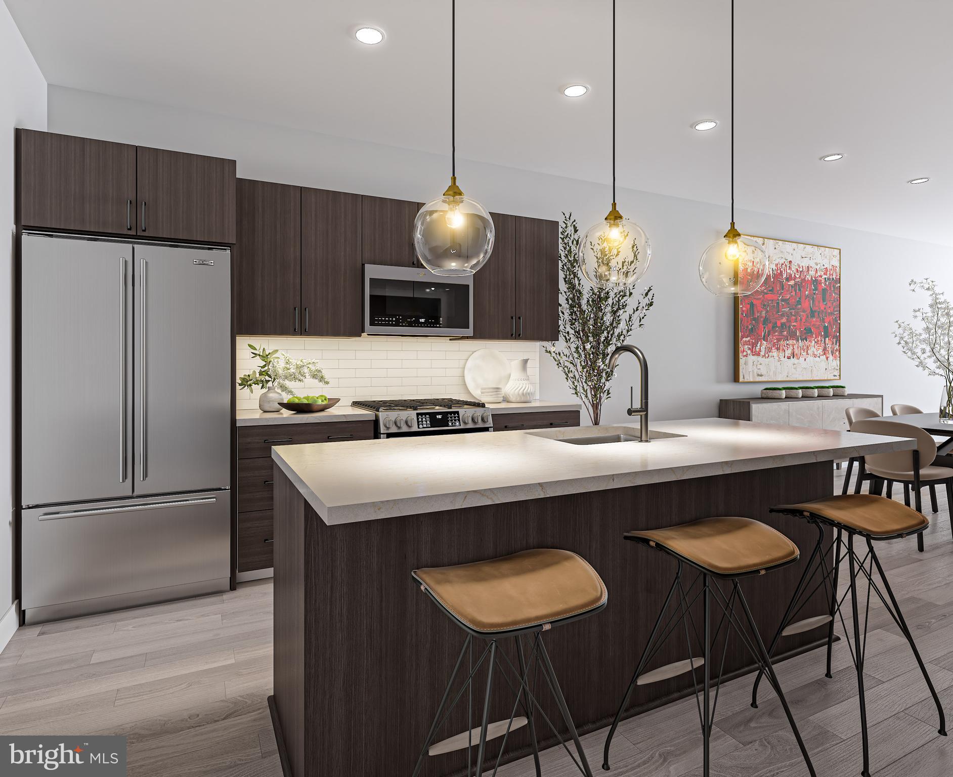 26 South York Road, Unit 403 Hatboro, PA 19040 - Photo 7 of 52 a kitchen with a table chairs and refrigerator