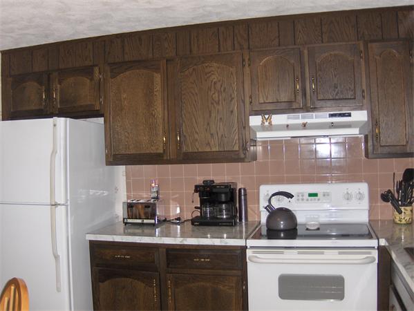 1754 Shirley Road Lancaster, MA 01523 - Photo 13 of 30 a kitchen with a sink a stove and cabinets