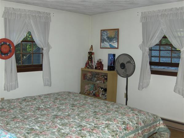 1754 Shirley Road Lancaster, MA 01523 - Photo 17 of 30 a bedroom with a bed and a dresser