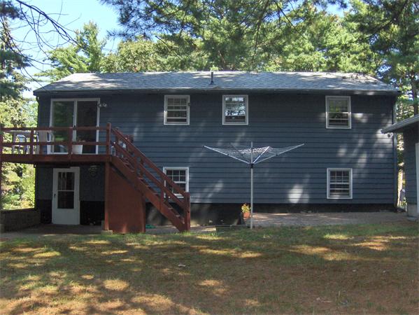 1754 Shirley Road Lancaster, MA 01523 - Photo 4 of 30 a front view of a house with a garden