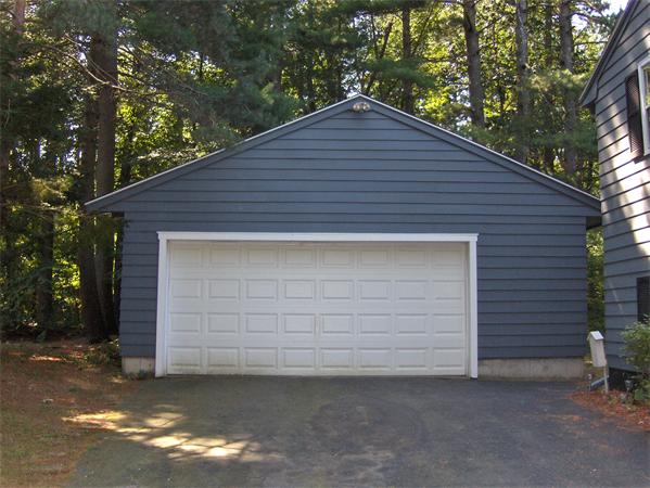 1754 Shirley Road Lancaster, MA 01523 - Photo 5 of 30 a front view of a house with garage