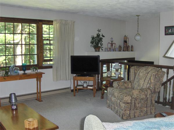 1754 Shirley Road Lancaster, MA 01523 - Photo 7 of 30 a living room with furniture and a flat screen tv