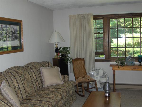 1754 Shirley Road Lancaster, MA 01523 - Photo 8 of 30 a living room with furniture and a window