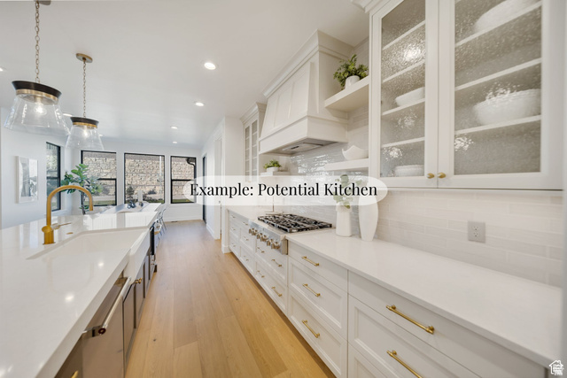 708 East Longview Drive Payson, UT 84651 - Photo 5 of 8 Dual tone kitchen with light wood finished floors, decorative backsplash, pendant lighting, glass insert cabinets, and stainless steel gas cooktop