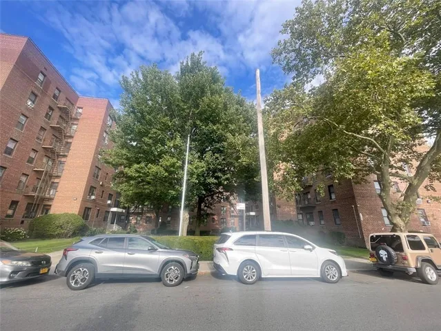 a green field with lots of trees