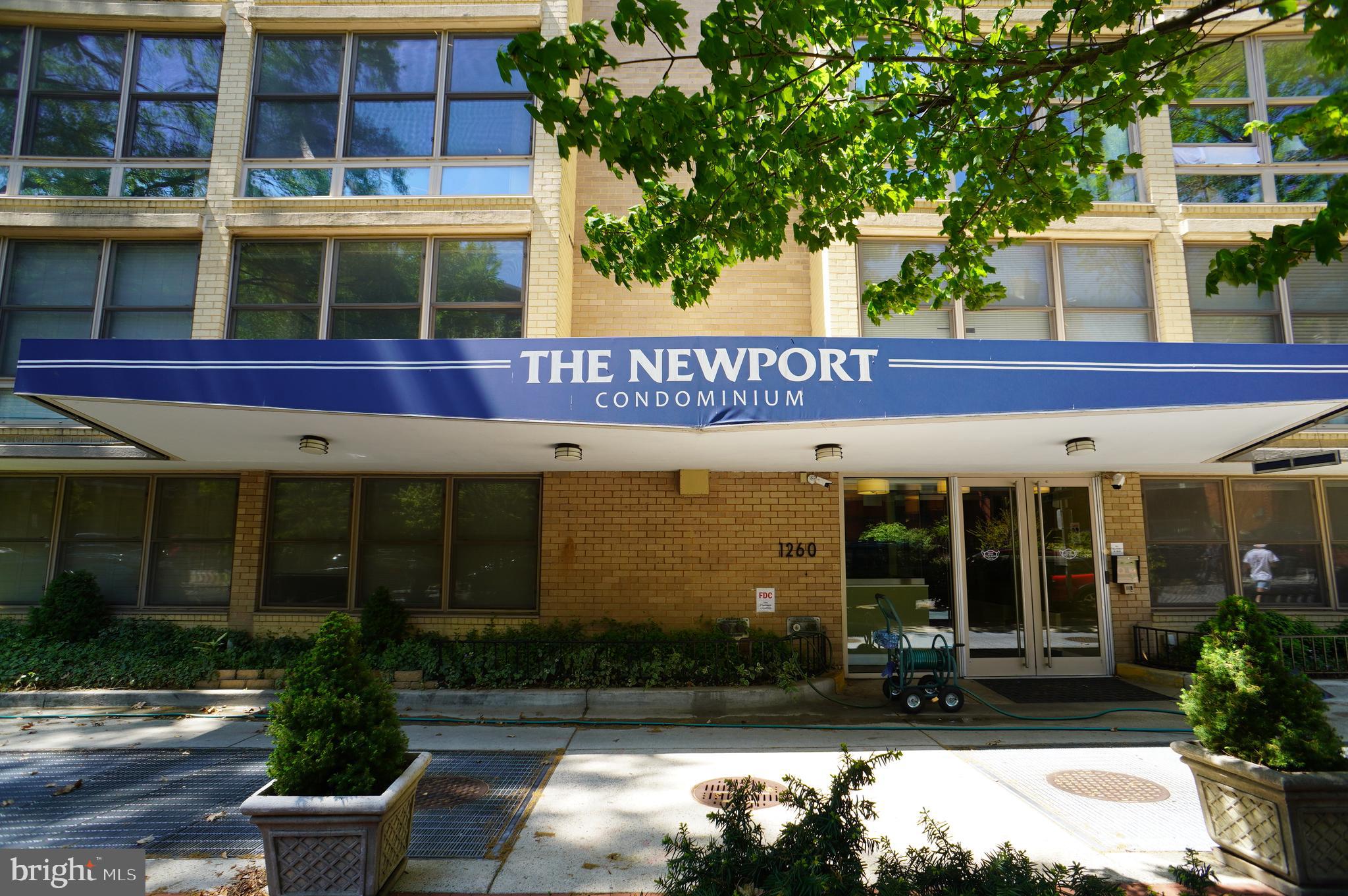 front view of a building with a garden