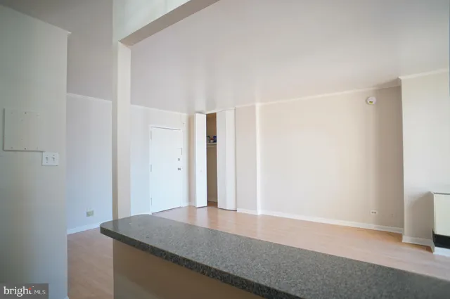 a room with a sink and a mirror