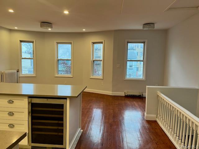 86-09 125th Street, Unit 2 Queens, NY 11418 - Photo 11 of 16 a view of an empty room with wooden floor and a window