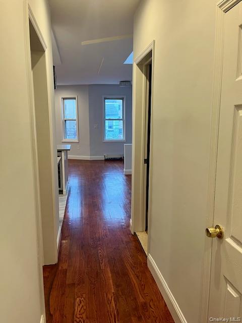 86-09 125th Street, Unit 2 Queens, NY 11418 - Photo 10 of 16 a view of a hallway with wooden floor and staircase
