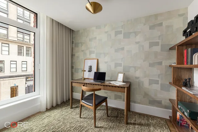 a workspace with furniture and window