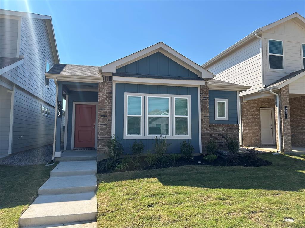 3008 Pecan Farm Lane Fort Worth, TX 76140 - Photo 1 of 10 a front view of a house with garden