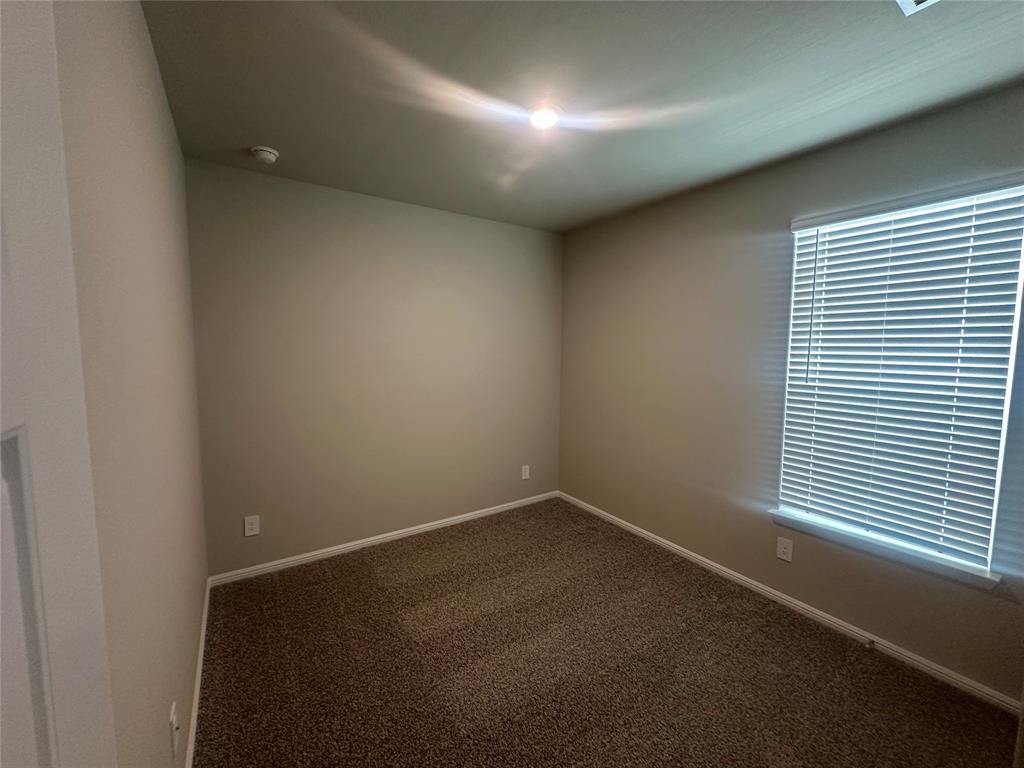 3008 Pecan Farm Lane Fort Worth, TX 76140 - Photo 9 of 10 an empty room with a window