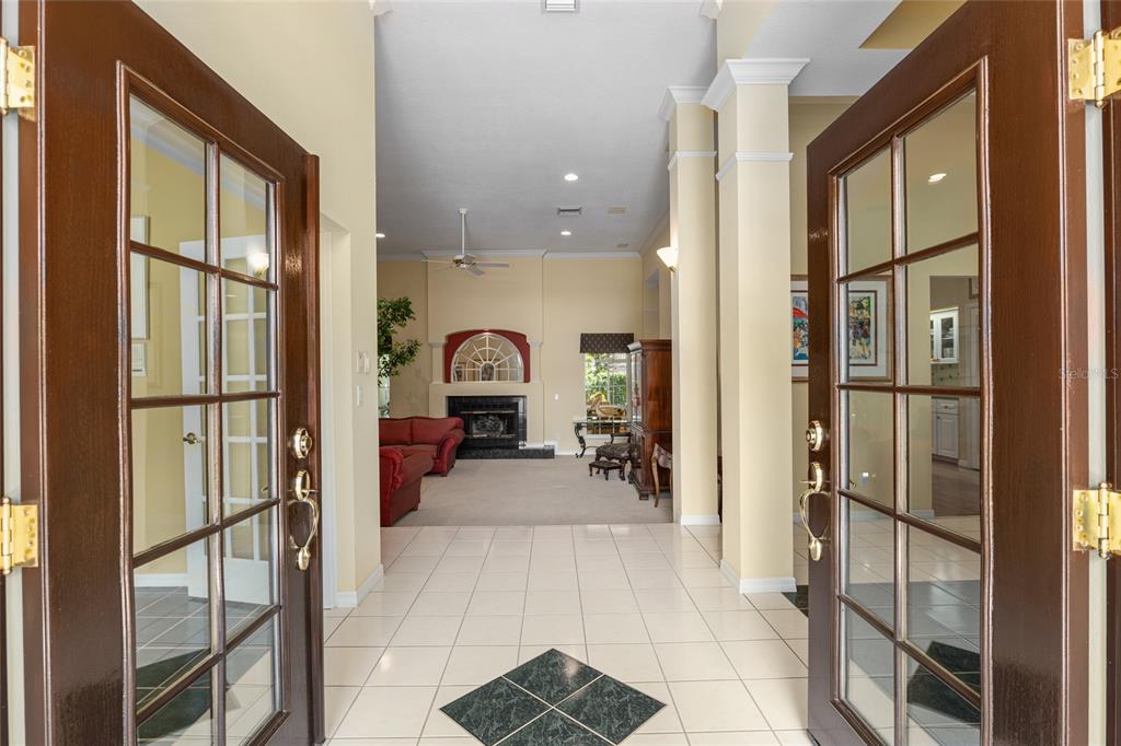 2215 Spring Hill Court Ocala, FL 34471 - Photo 3 of 62 a view of a hallway with living room and furniture