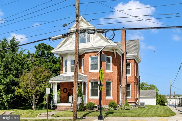 a front view of a house with a porch