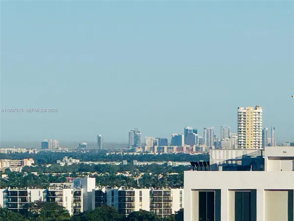 a view of a city with tall buildings
