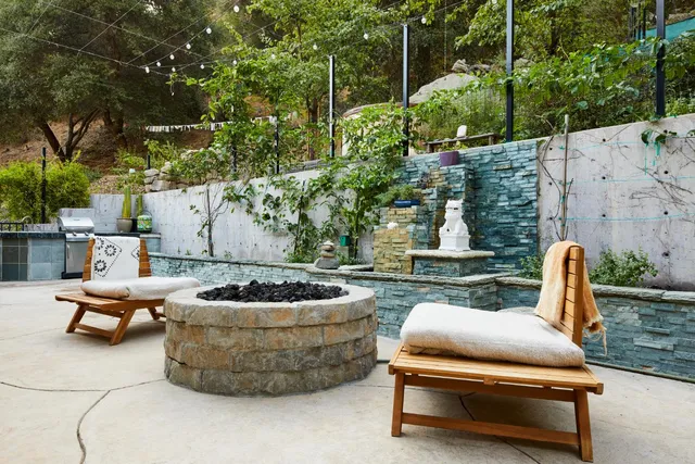 a bedroom with a bed and large windows