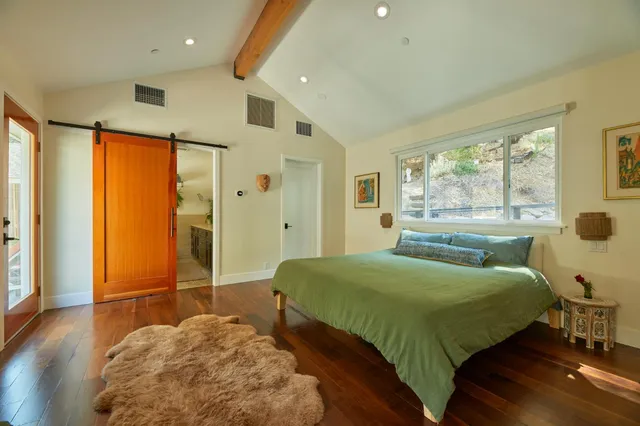 a bathroom with a double vanity sink a mirror and a shower