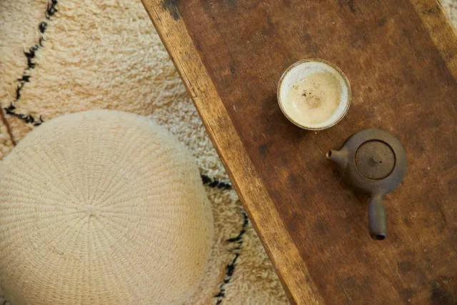 a kitchen with a stove a sink cabinetry and a refrigerator