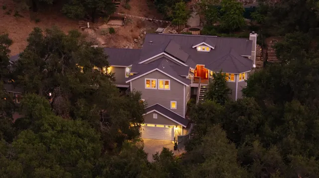 a bedroom with a bed and windows