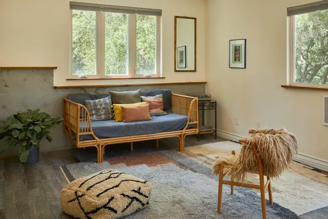 a balcony view with a seating space