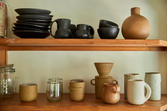 a stove top oven sitting inside of a kitchen