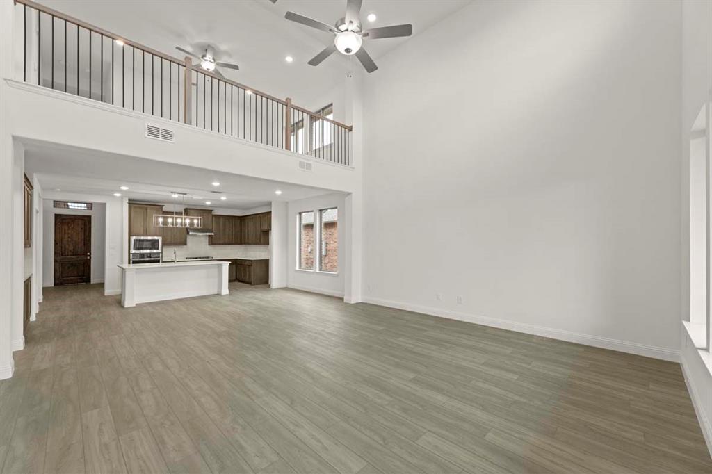 1443 Canadian Lane Van Alstyne, TX 75495 - Photo 7 of 24 07-1443-canadian-ln-van-alstyne-tx-family-room-high-ceilings